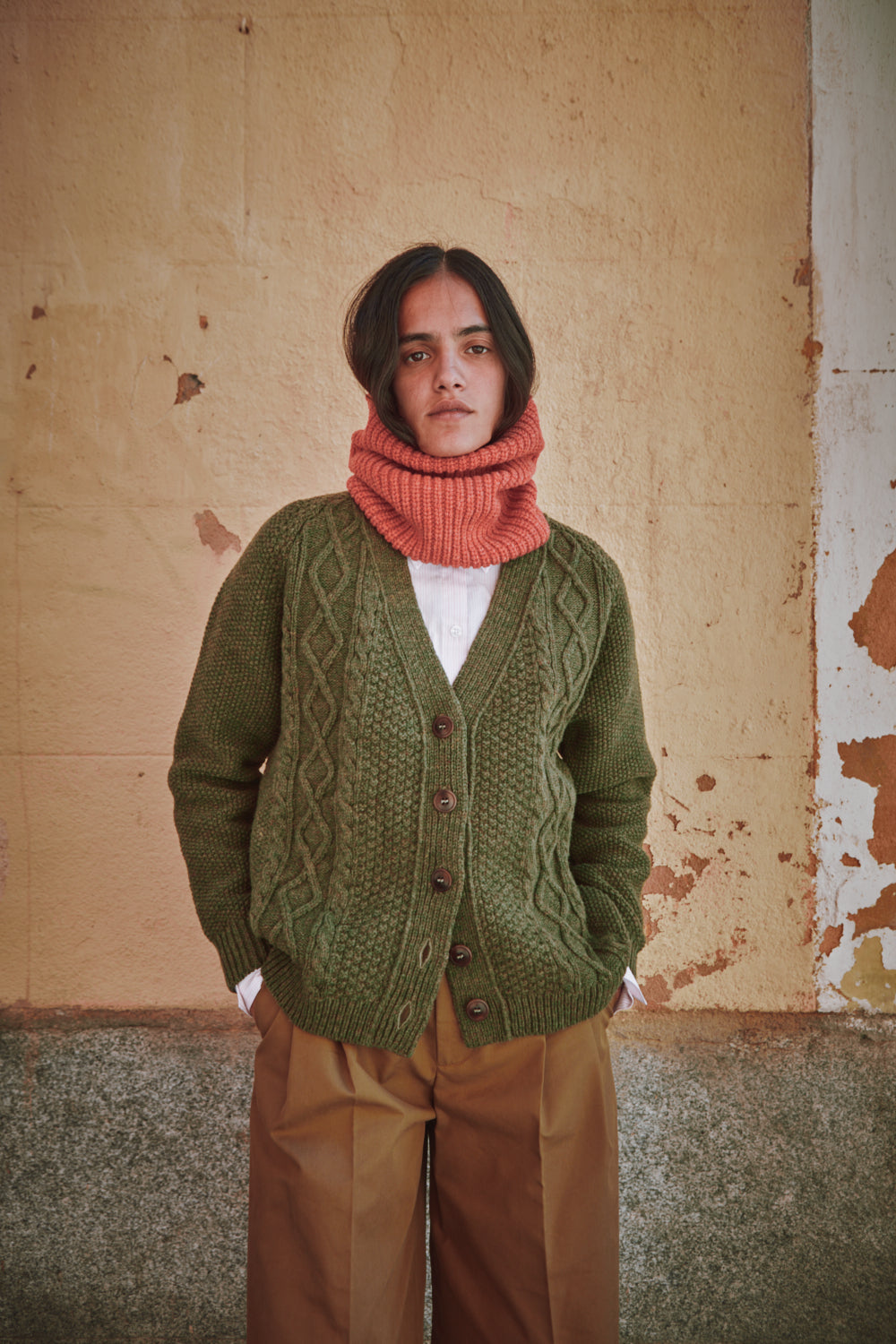 woman wearing a green cardigan and the AMANDINE from L'ENVERS in Coral 