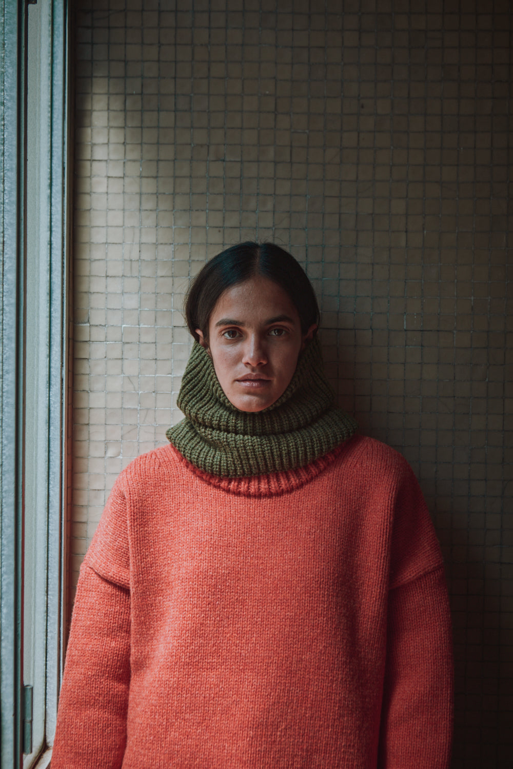 woman standing in front of all wall wearing AMANDINE Coral L'ENVERS 